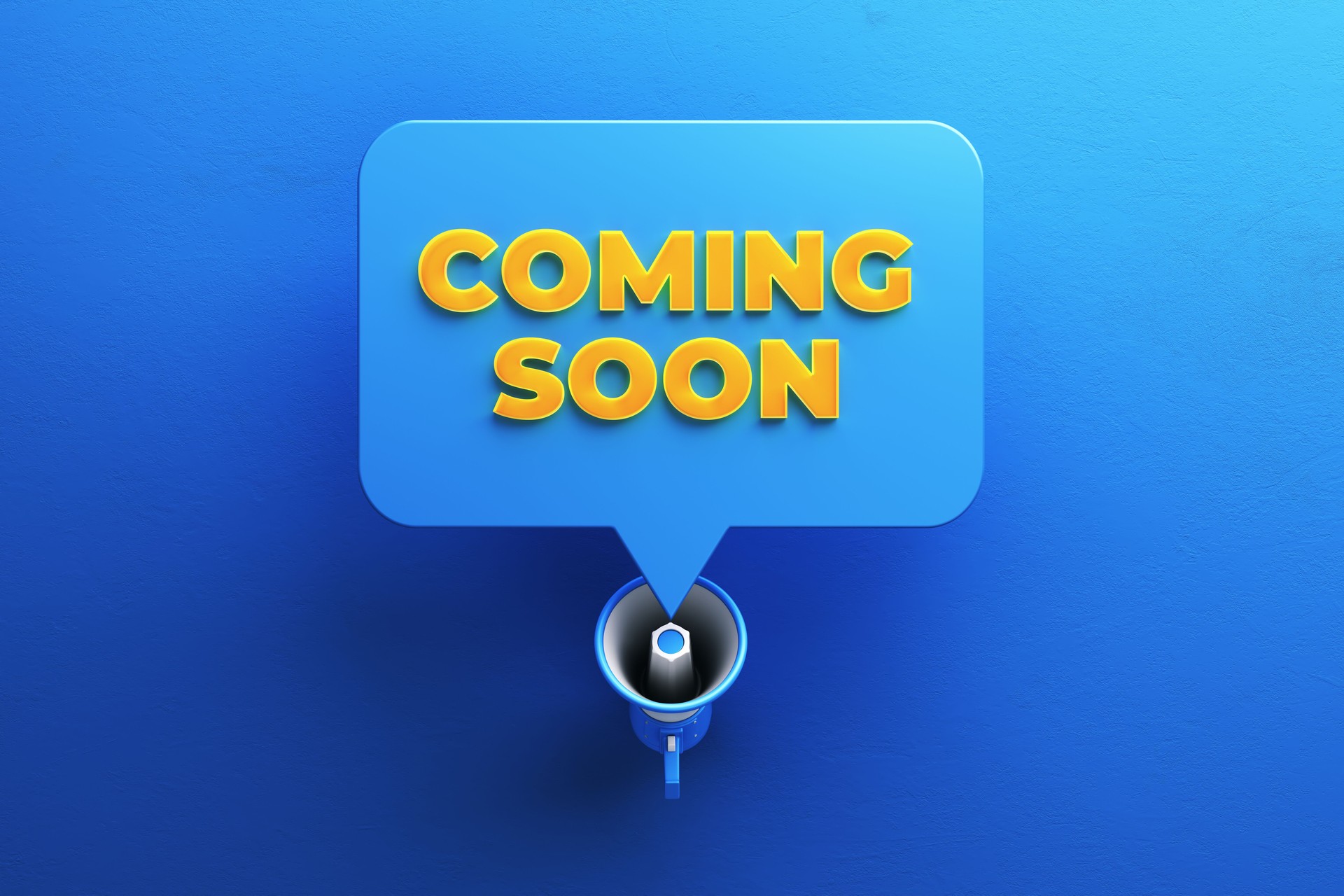 Coming Soon Written Speech Bubble and Blue Megaphone on Red Background stock photo